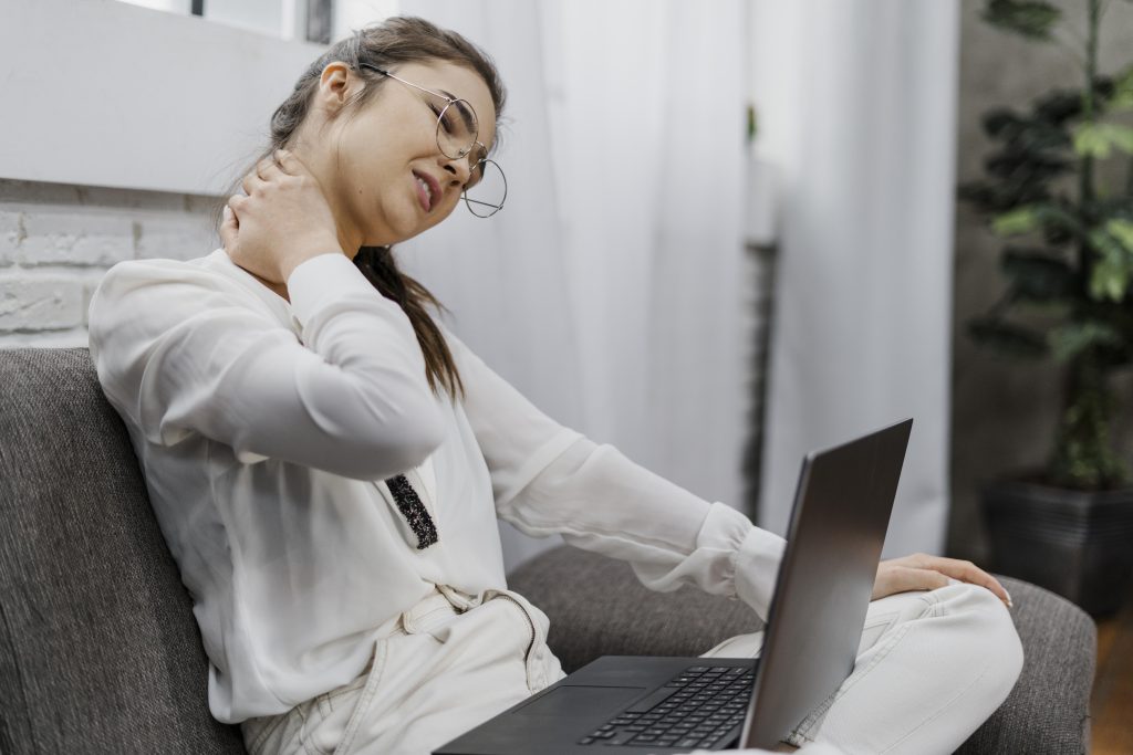 woman-having-neckache-as-she-works-home